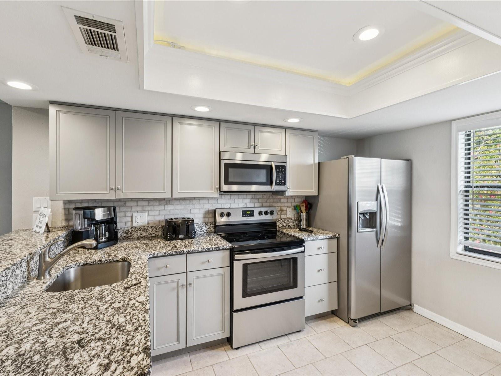 Newer cabinets, granite and stainless appliances