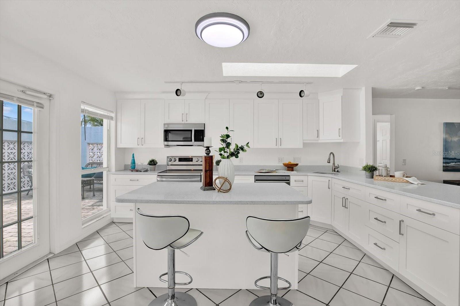 Spacious white kitchen with plenty of storage!