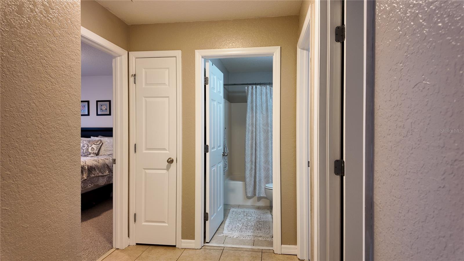 MAIN BATHROOM ENTRANCE  TO THE LEFT IS ANOTHER BEDROOM