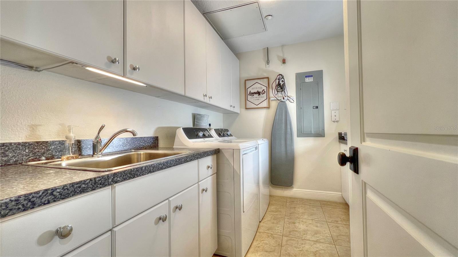 Large laundry room with sink