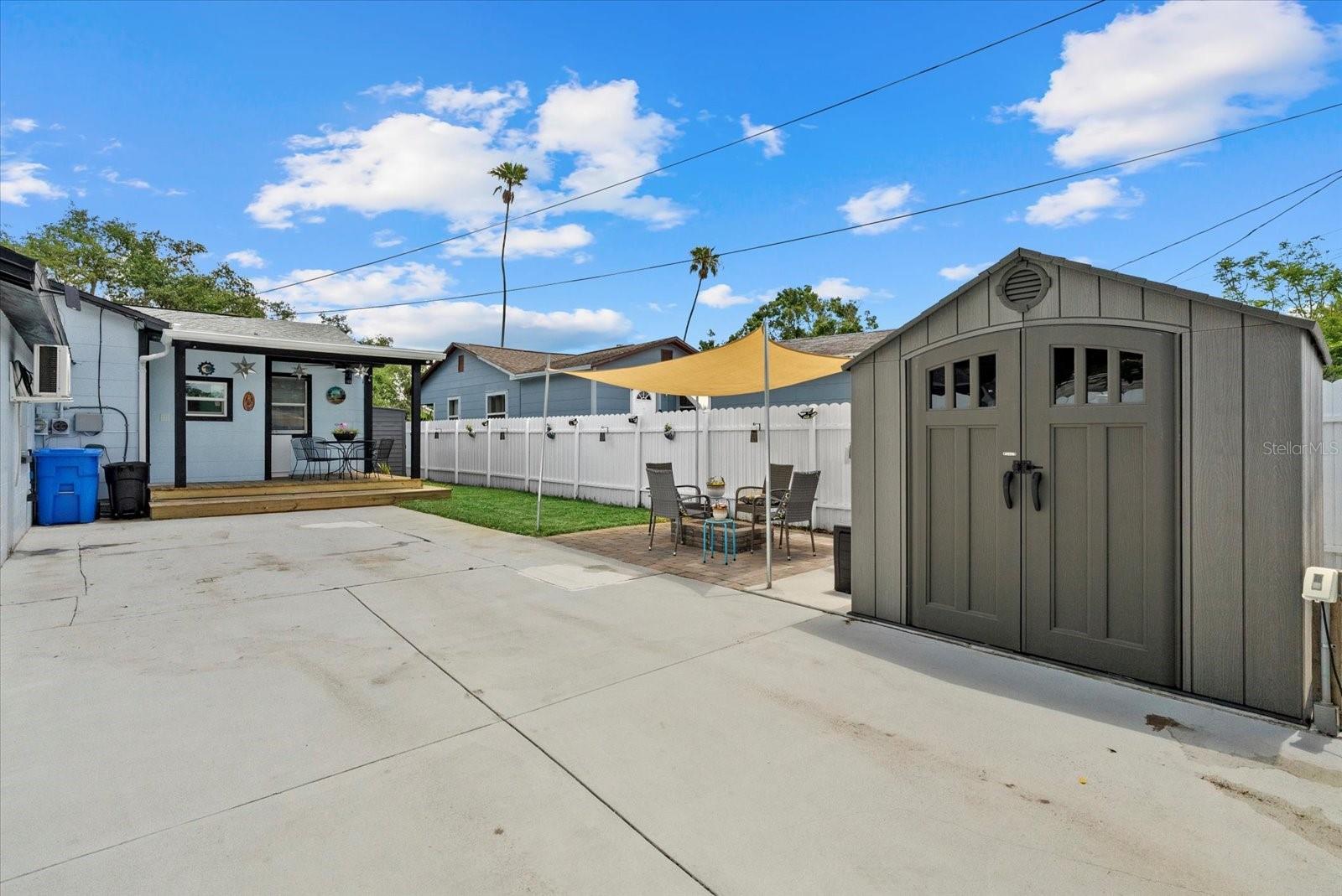 Main home backyard and parking with shed
