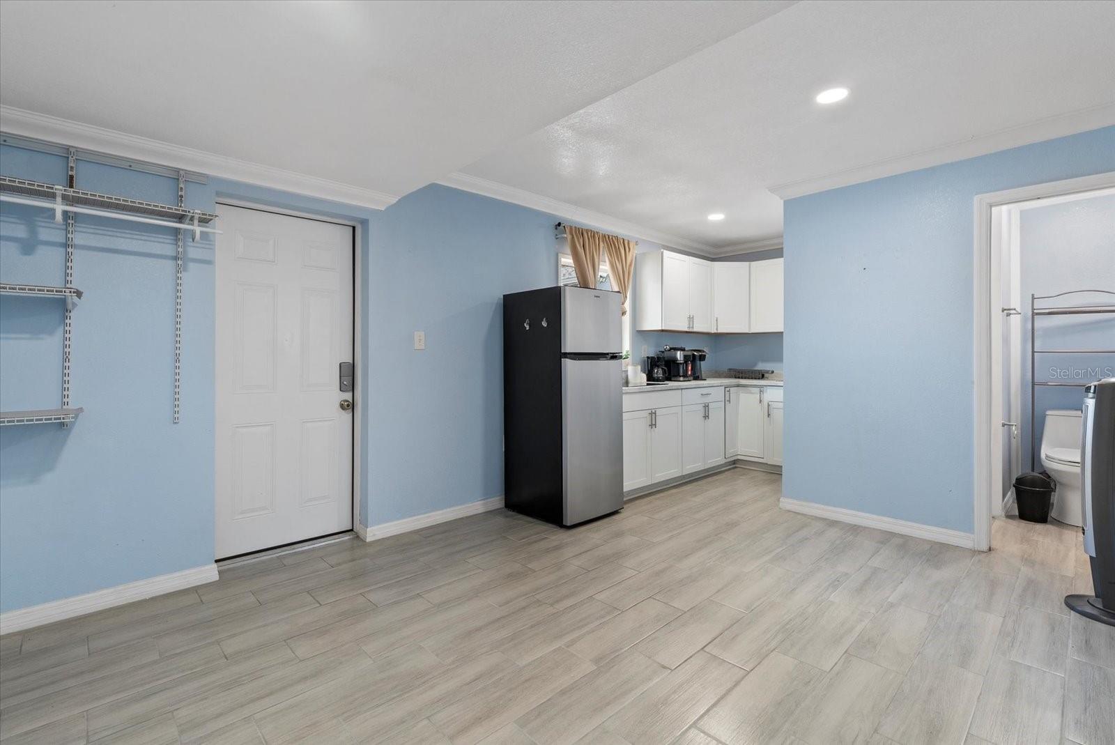 Main living area to kitchen - Studio Apt