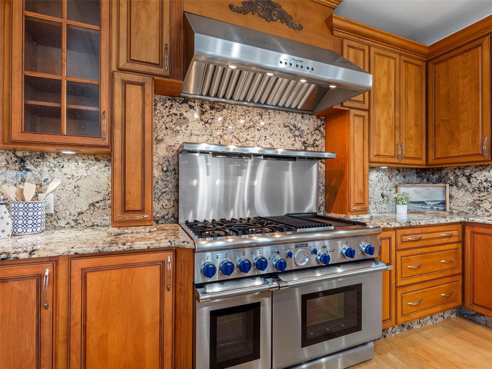 48" Thermador gas range with griddle and grill.