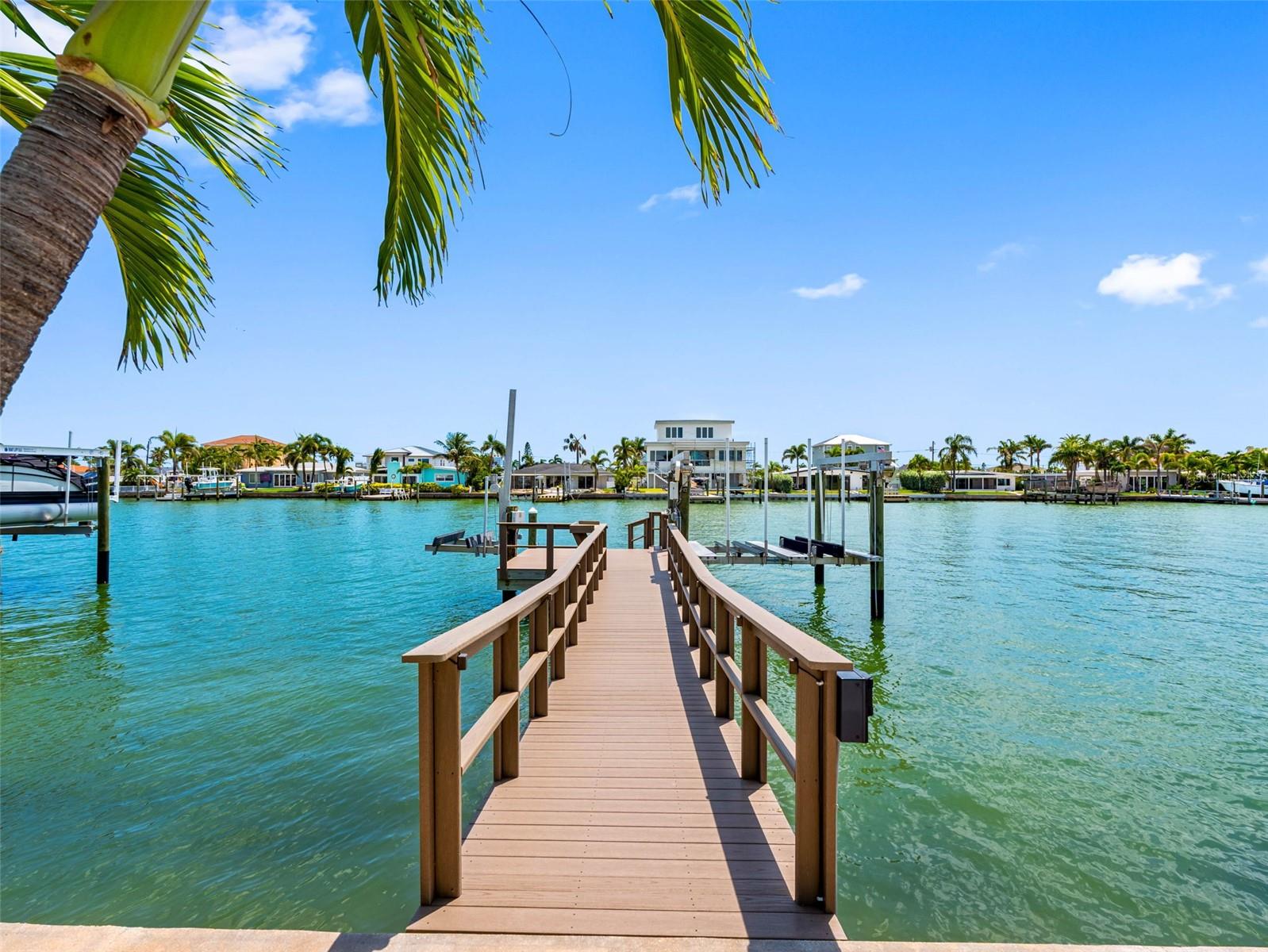 Composite dock with 10,000 boat lift fitted for two jet skiis plus a single jet ski lift.