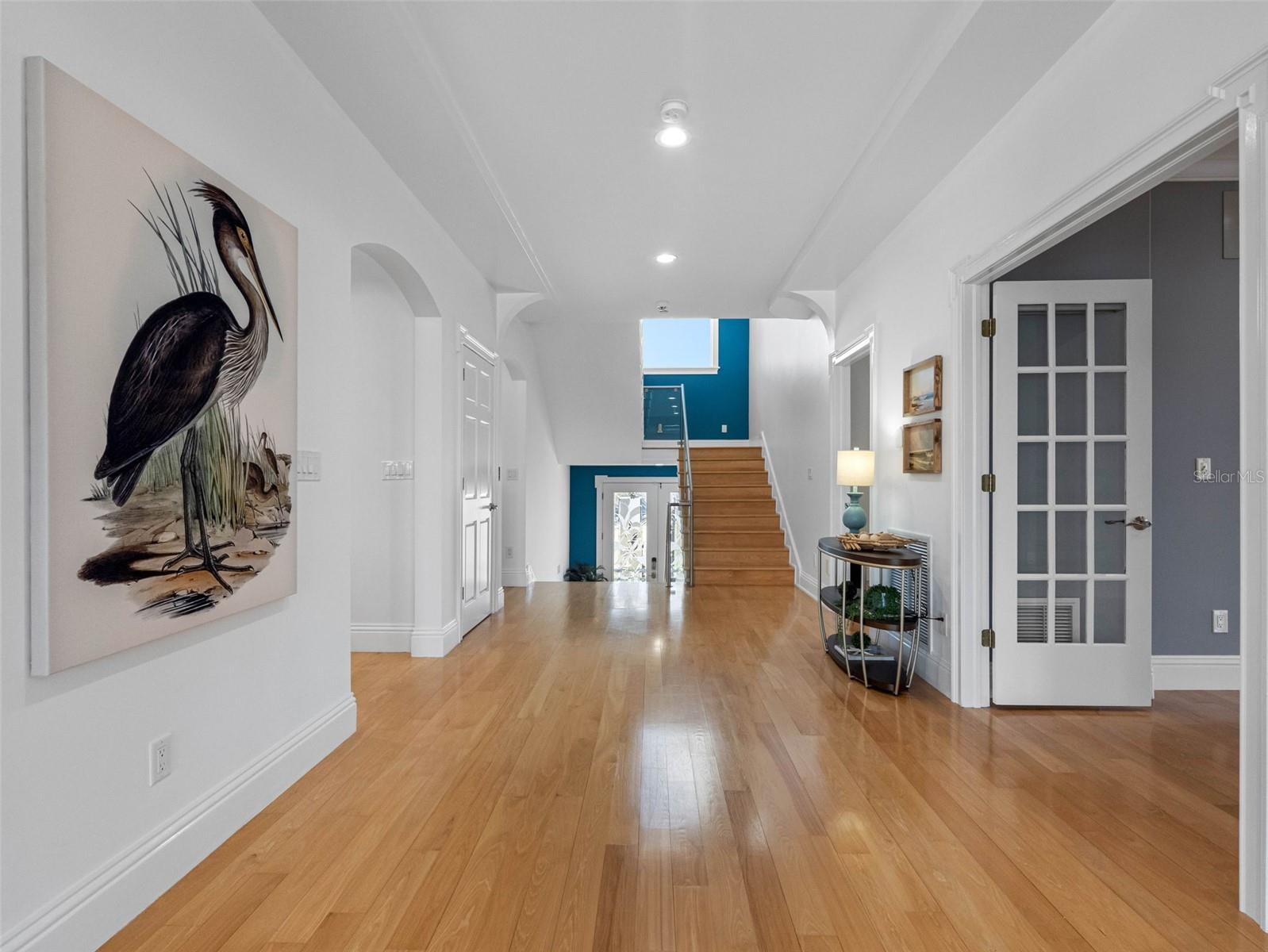 Wide open hallway also opens to two bedrooms on the first living level.