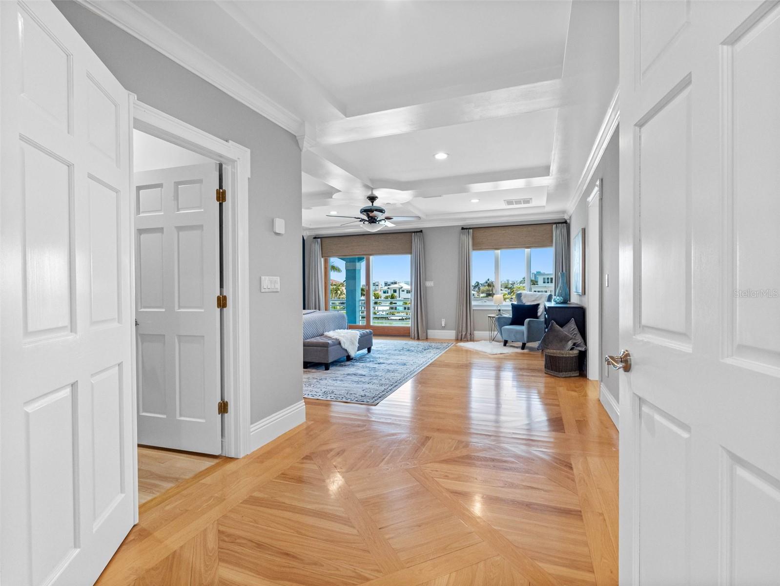 Hallways leads to two more bedrooms.