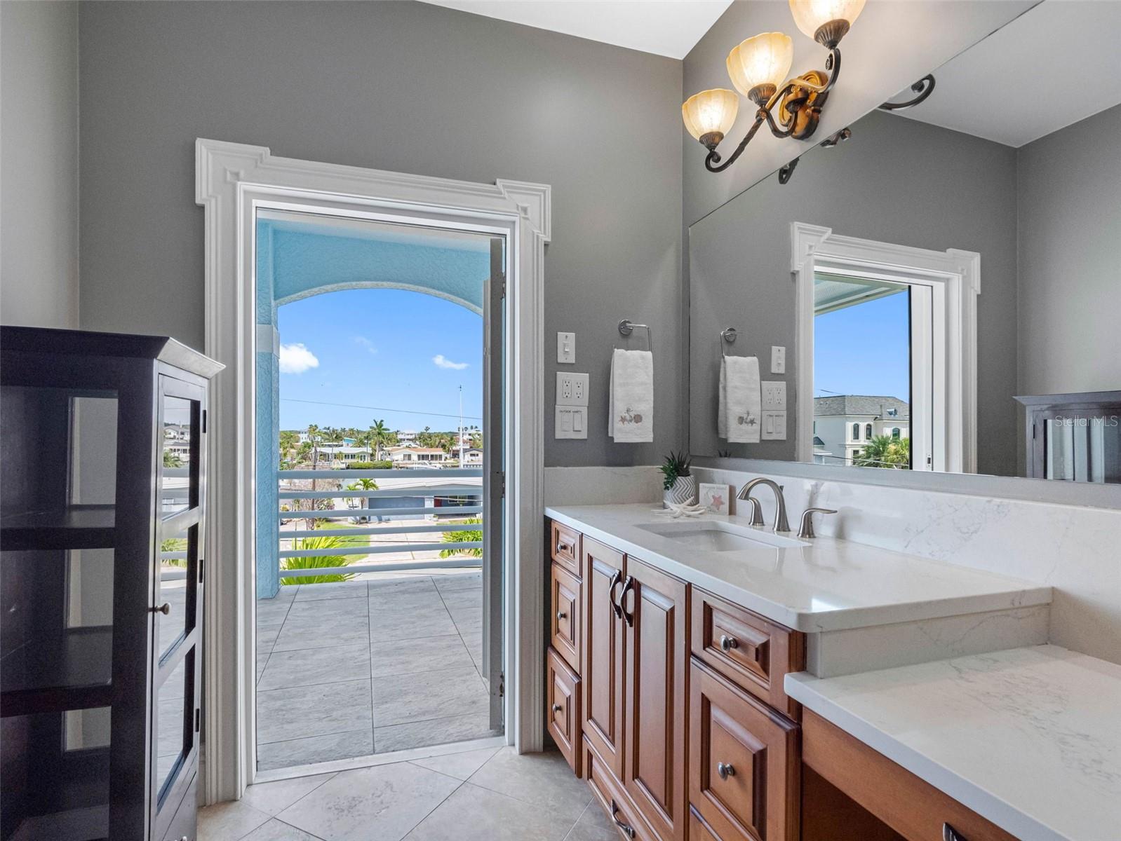 Ensuite bath opens to second balcony at the front of the home.