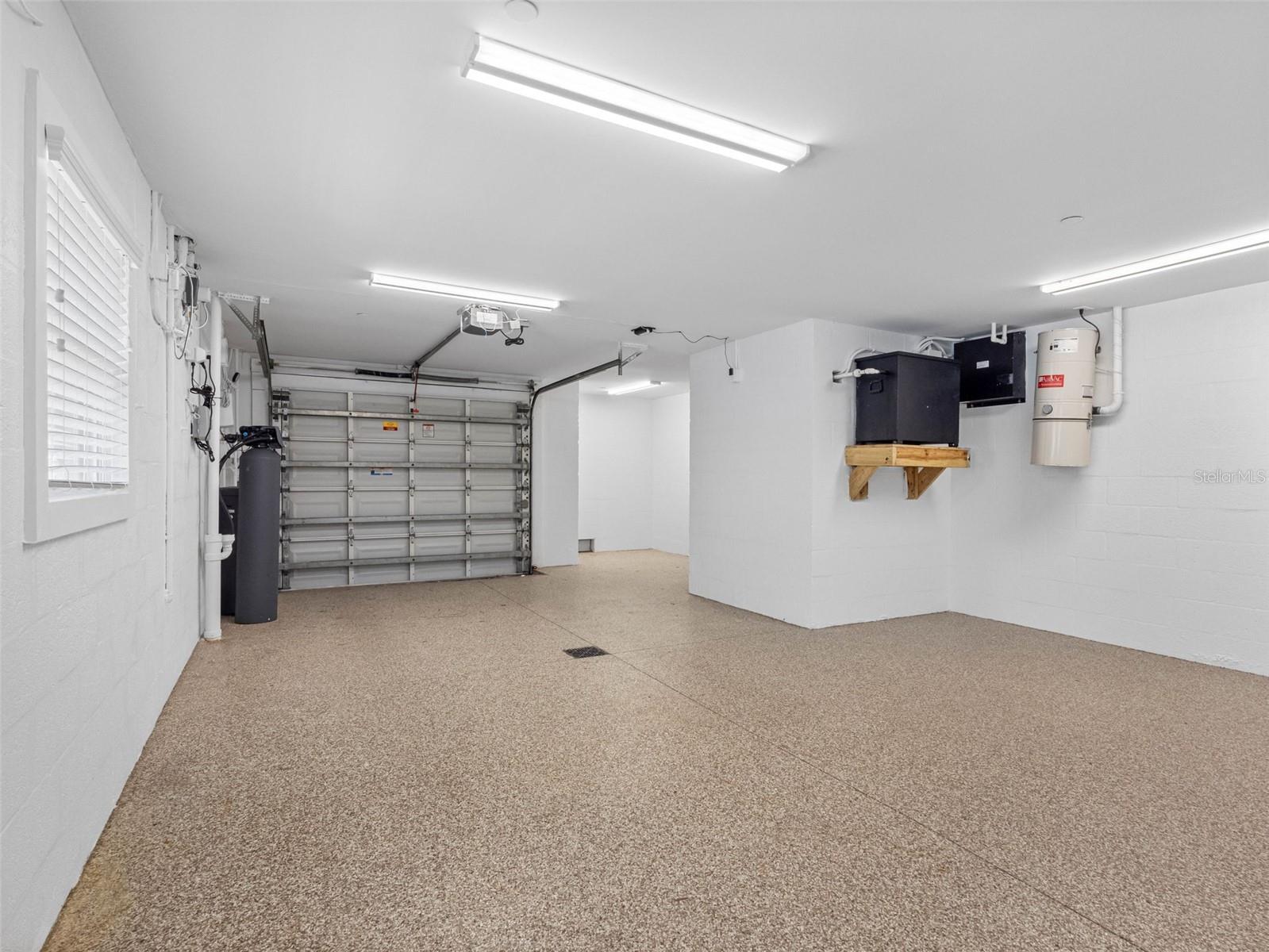 Garage with epoxy flooring.