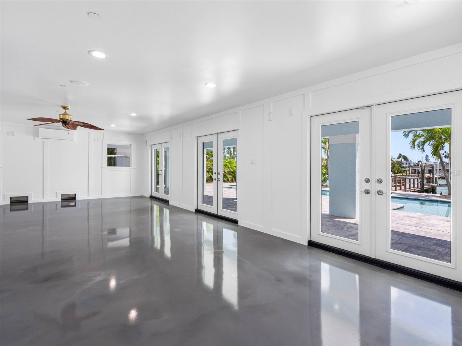 Impact French doors lead to the outdoors.