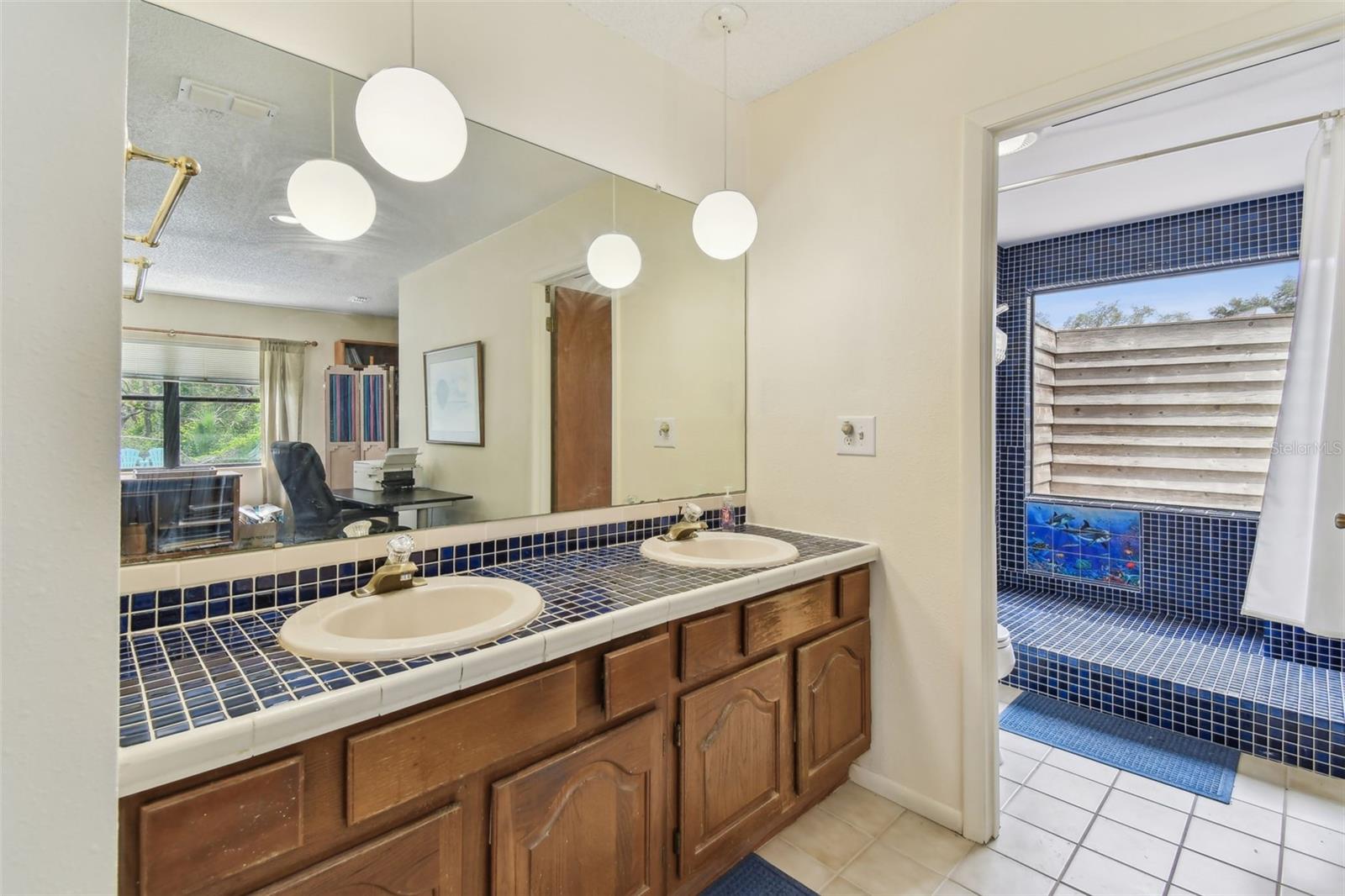 Double Vanities positioned outside the ensuite bathroom