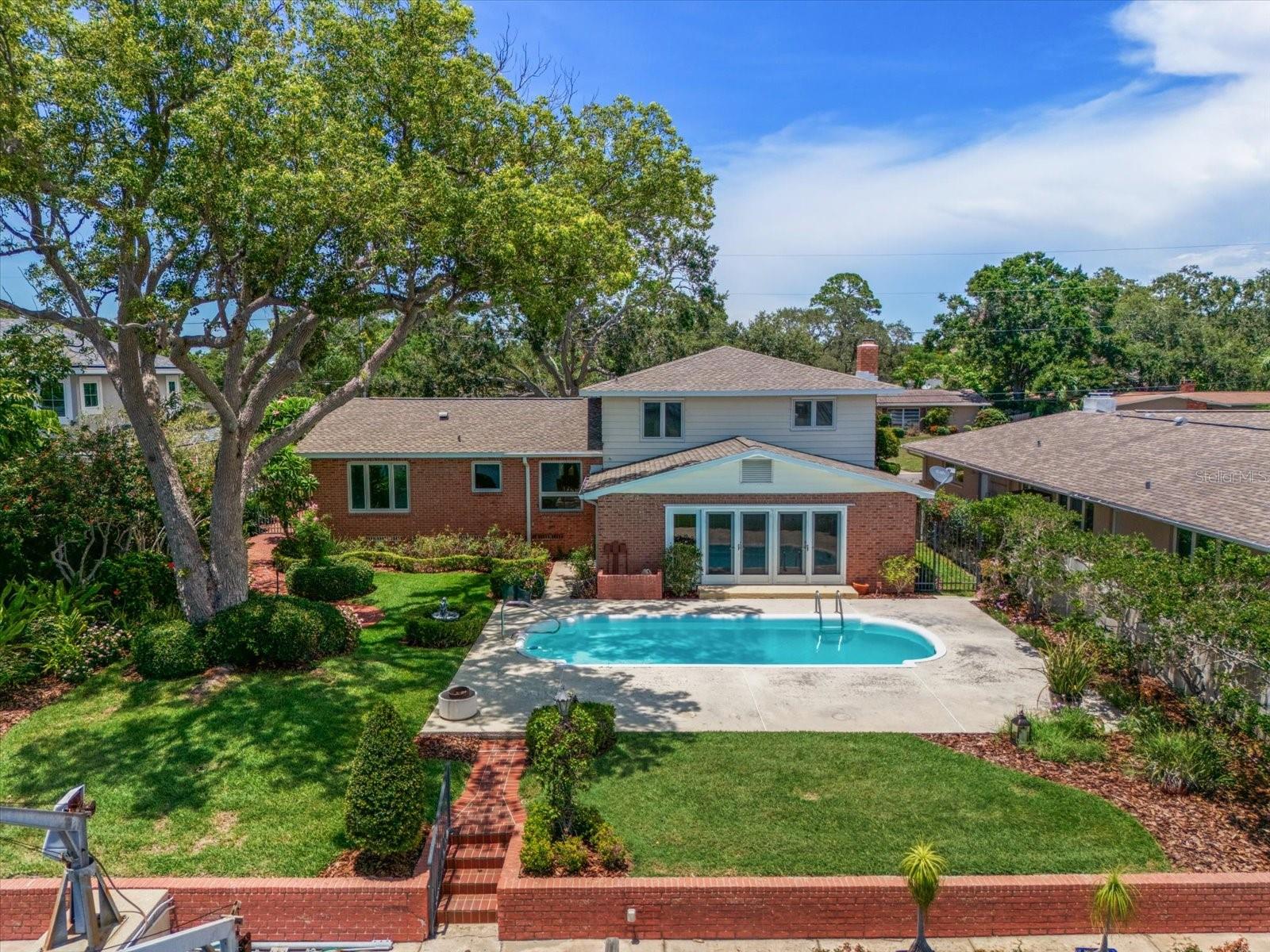 Family room opens to the pool and waterfront