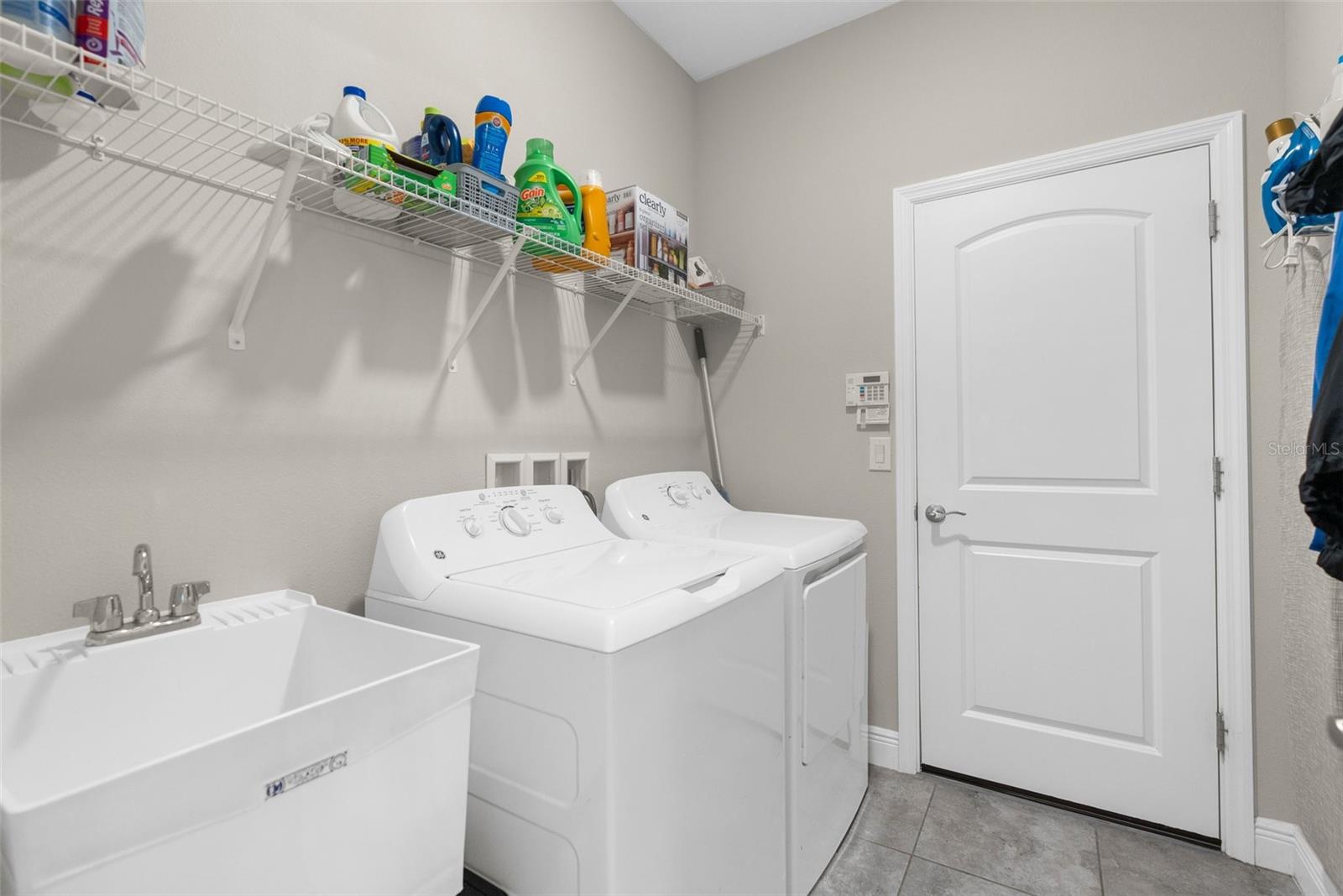 laundry in hall with 4th bedroom