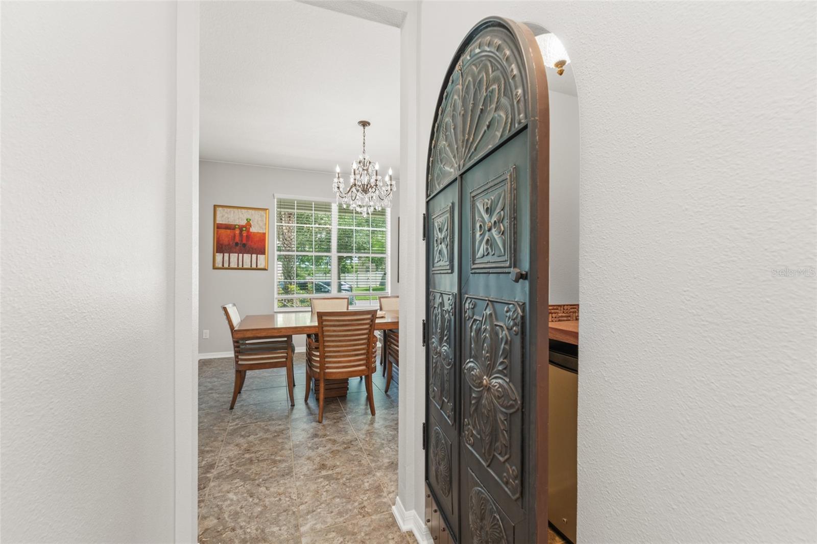 Convenient access to the butler pantry and built in bar