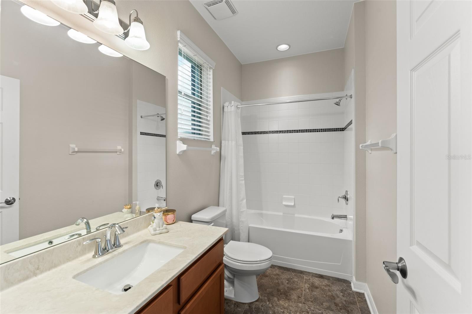 4th full bath on the main floor- with nearby access to the pool deck.
