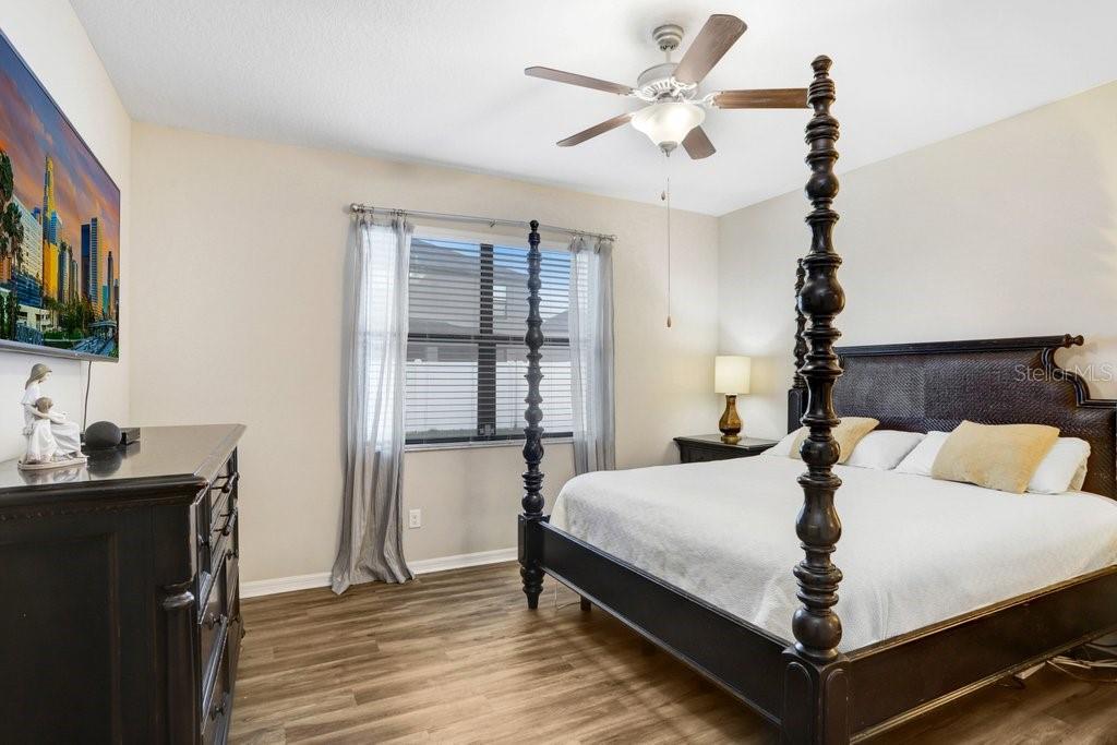 primary bedroom with luxury vinyl flooring