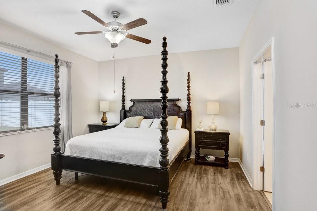 primary bedroom with luxury vinyl flooring