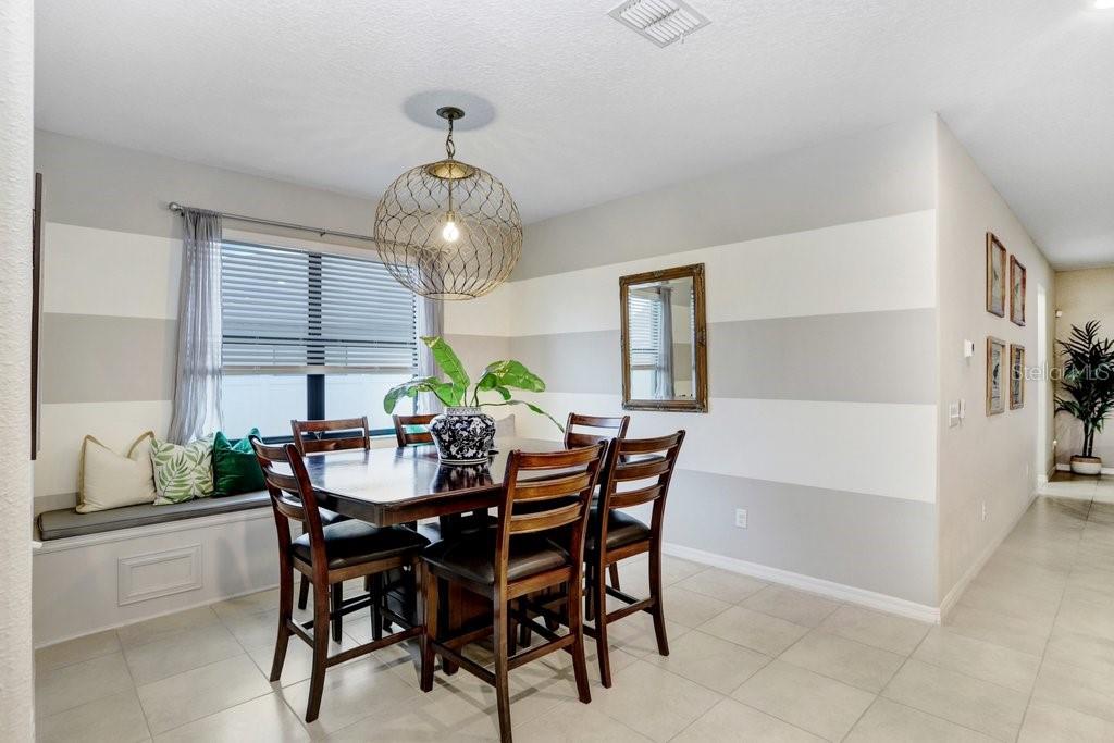 formal dining area with a custom window seat