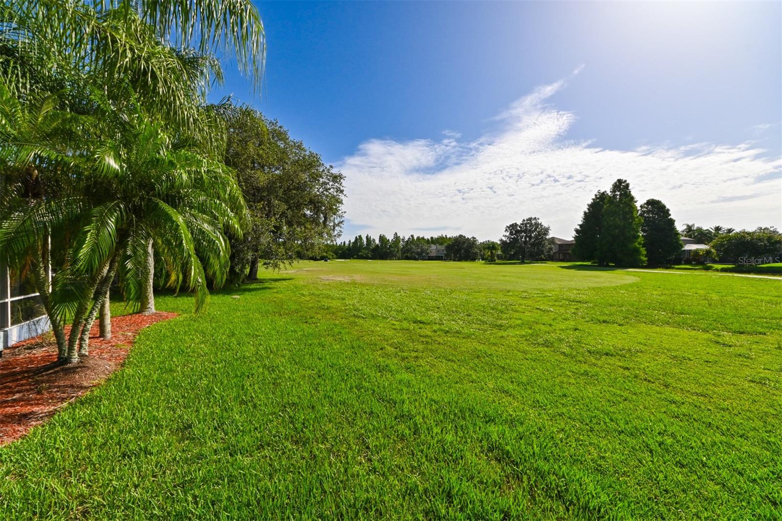 Back of home is seen just to the left in this photo. View is of 9th hole on the golf course
