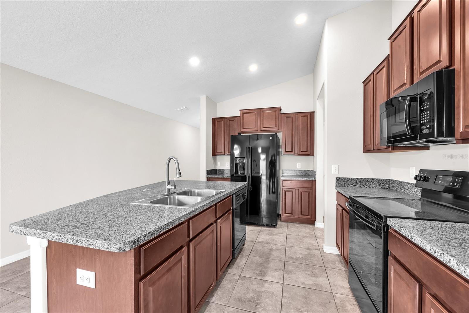 The upgraded kitchen features a large island making it a true hub for hosting or everyday living.