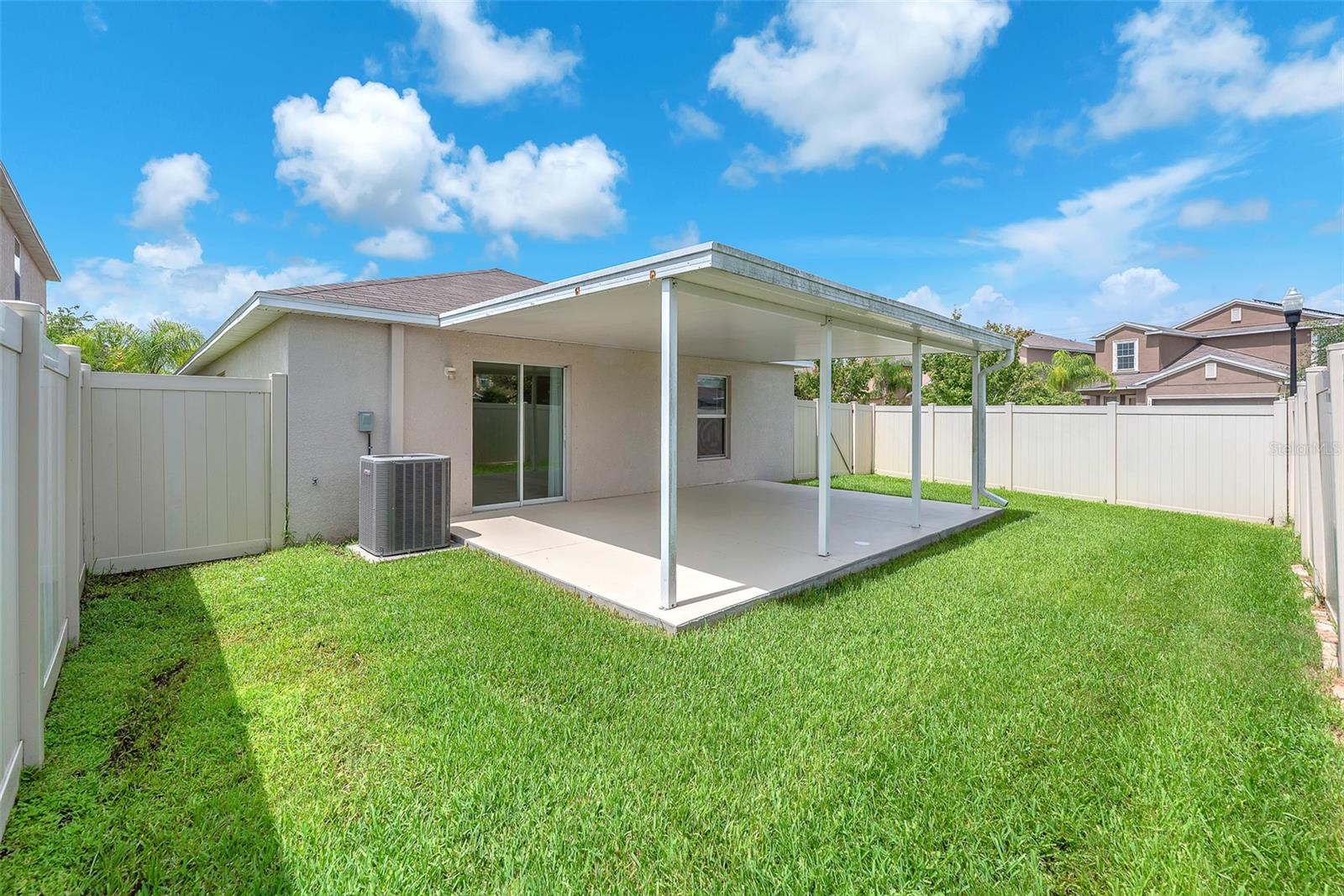 The fully fenced backyard and upgraded covered patio create the perfect space for relaxing.
