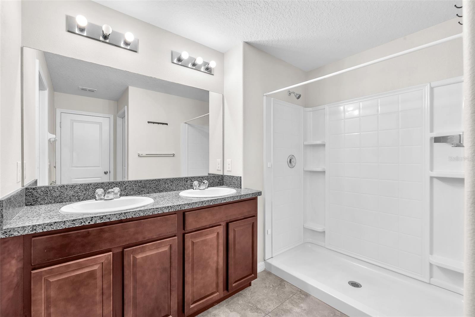 Double sinks, walk-in shower, and a private water closet in the Owner's ensuite.