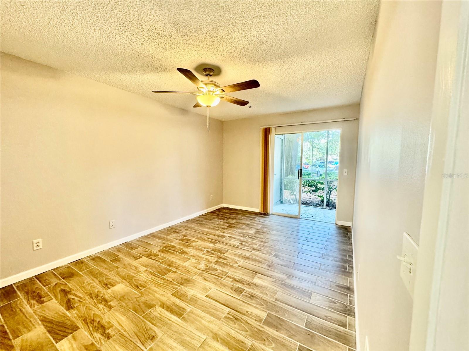 Master bedroom with sliders to patio