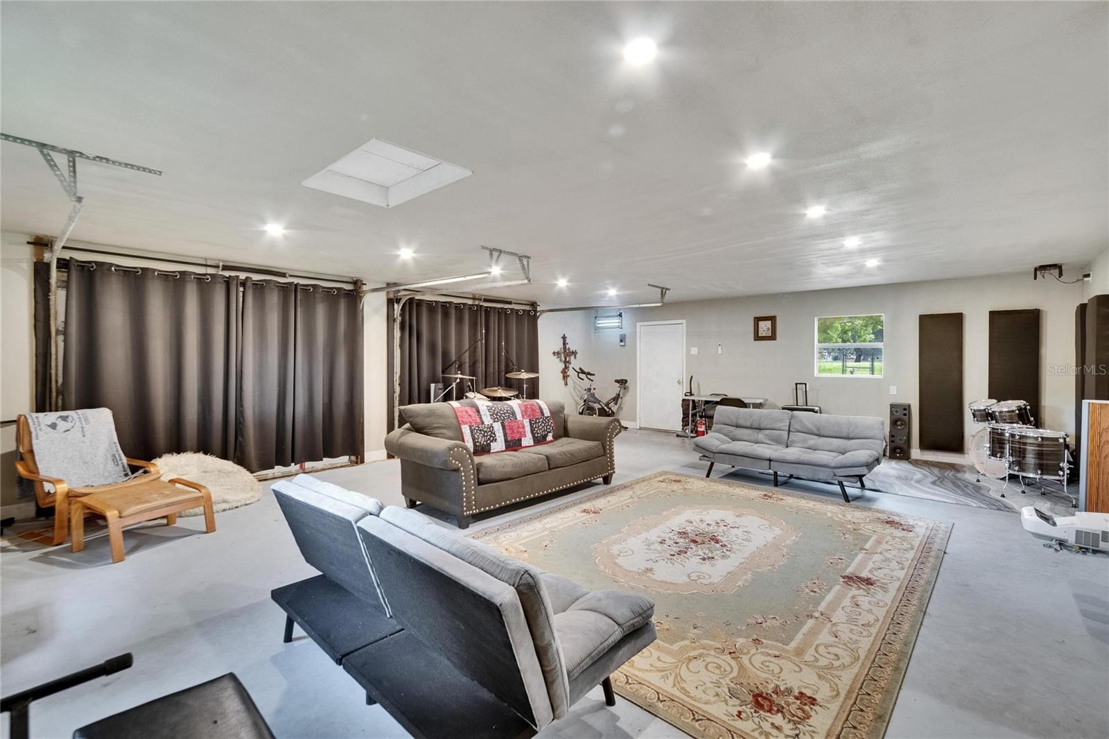 Inside Detached Garage/Workshop/Office ..  This area has electric and has Air Condition
