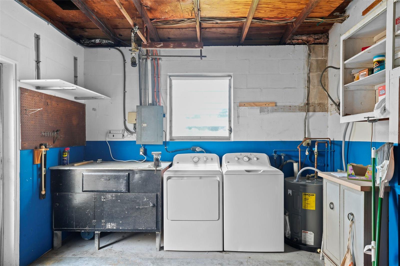 Oversized one car garage with a full size washer and dryer.