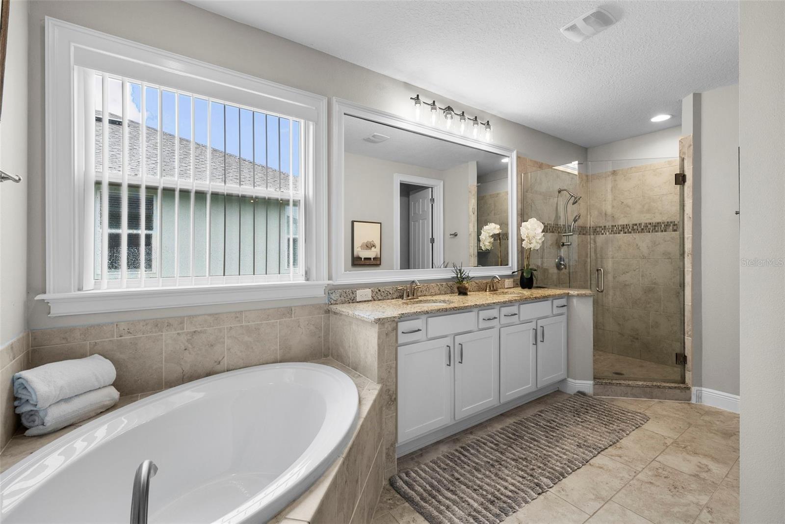 Spa-like bath with glass shower plus soaking tub