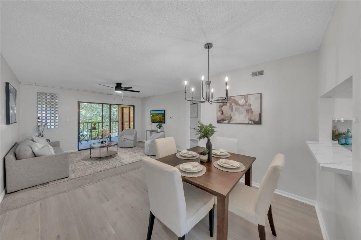 Enter into your open concept living/dining space down the hallway and past the generous sized kitchen to unwind from the day
