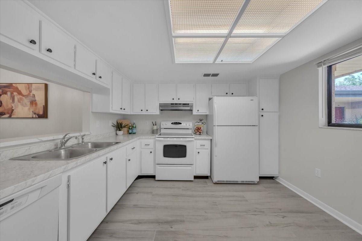 Laminate flooring and nice overhead lighting