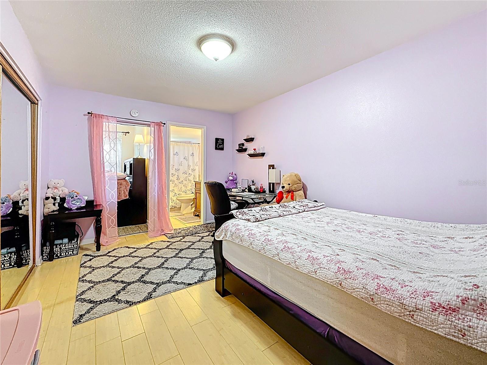 This bedroom opens onto the bonus room which could be used as a private sitting area and sunroom. It also features an en-suite bathroom.