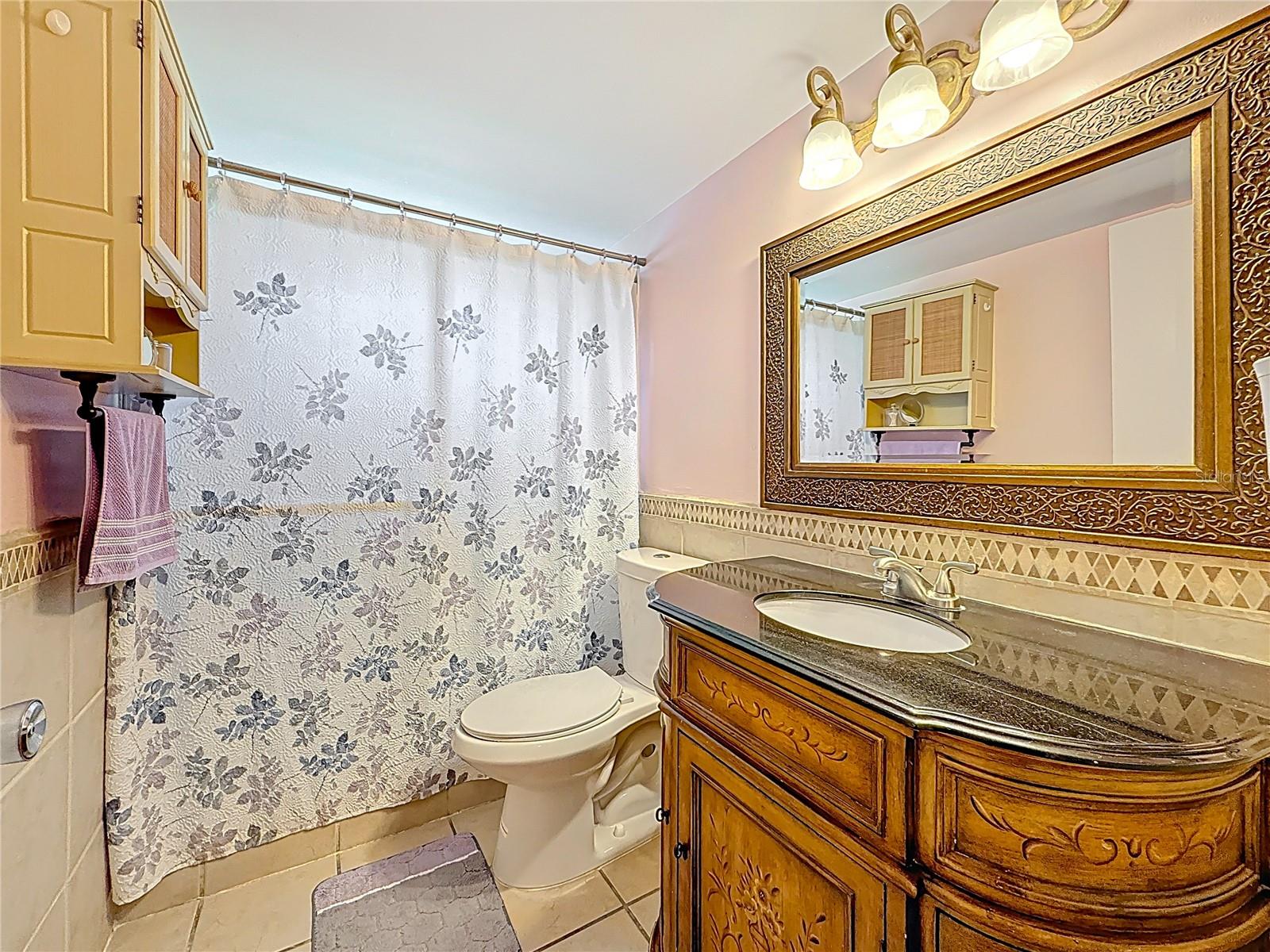 The en-suite bathroom has a full walk-in shower with no tub.