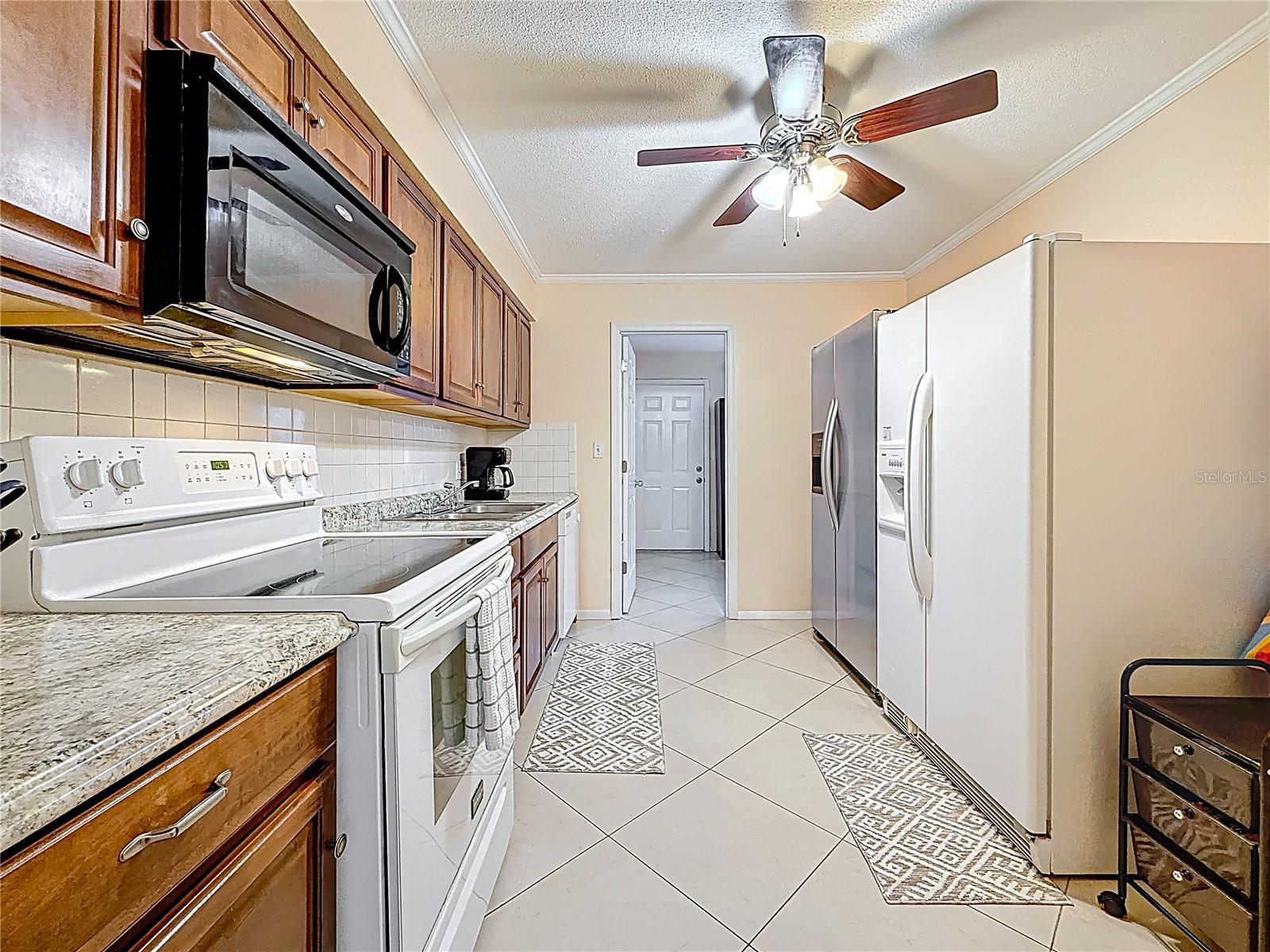 f you don't need two refrigerators there is ample space in the kitchen for a movable chefs butcher-block prep table.
