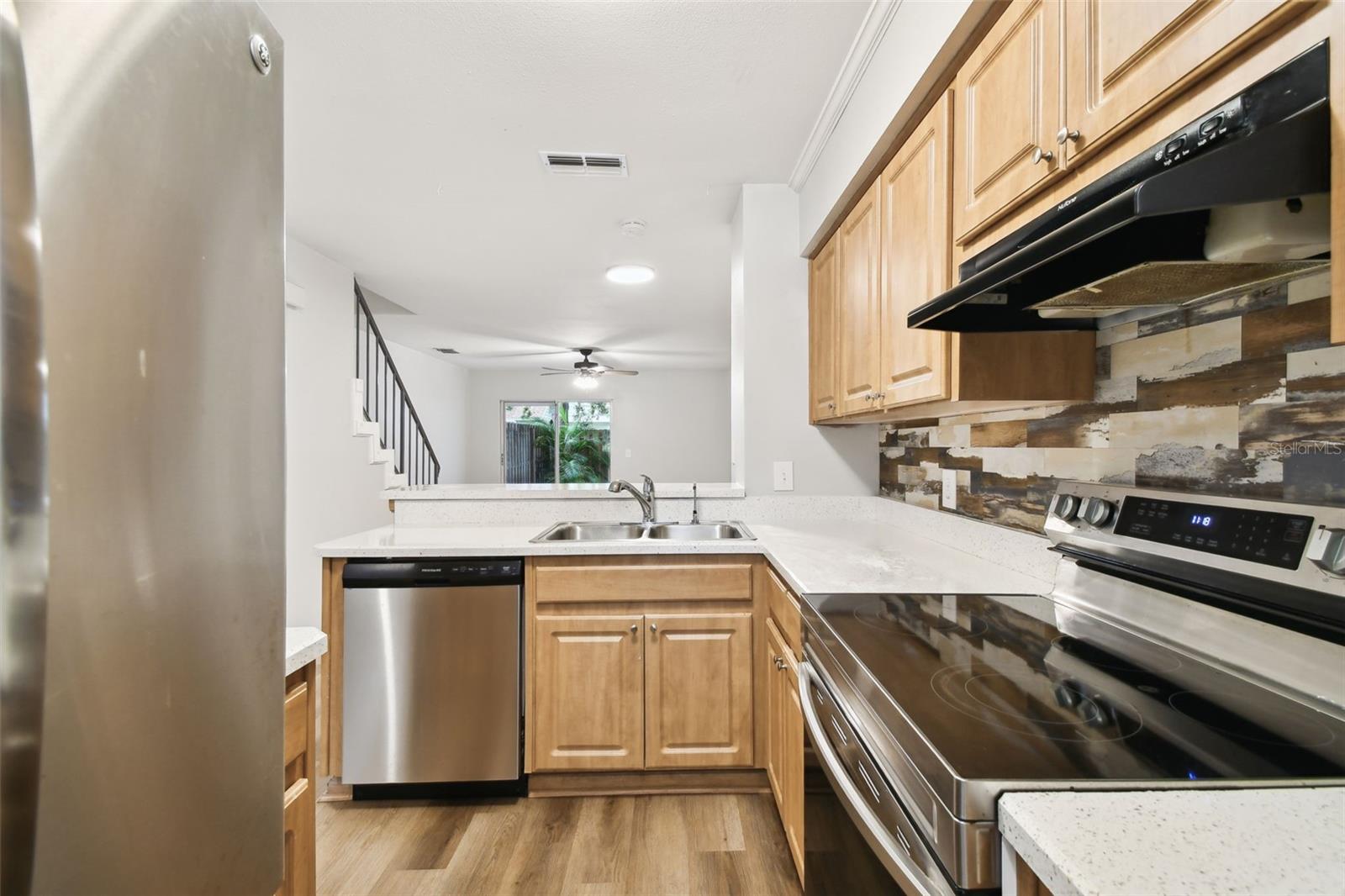 Kitchen wood cabinets stainless steel appliances