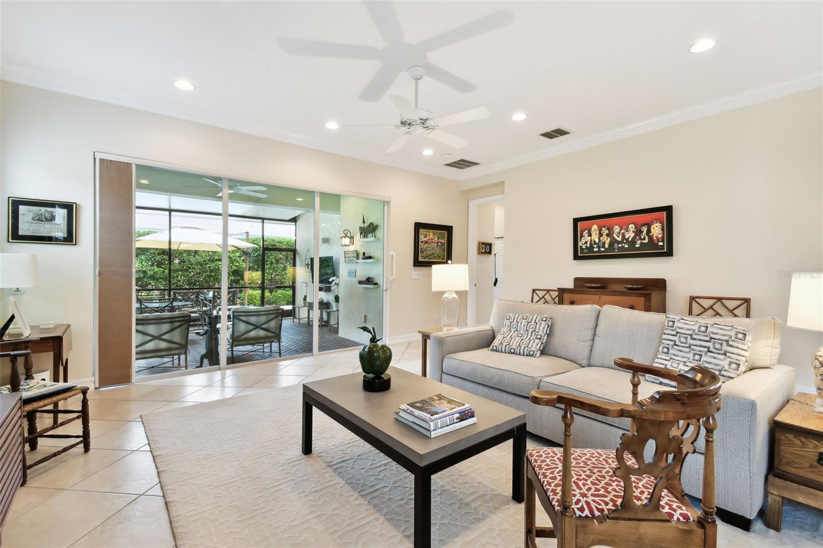 Living room flows onto the covered and open air lanai