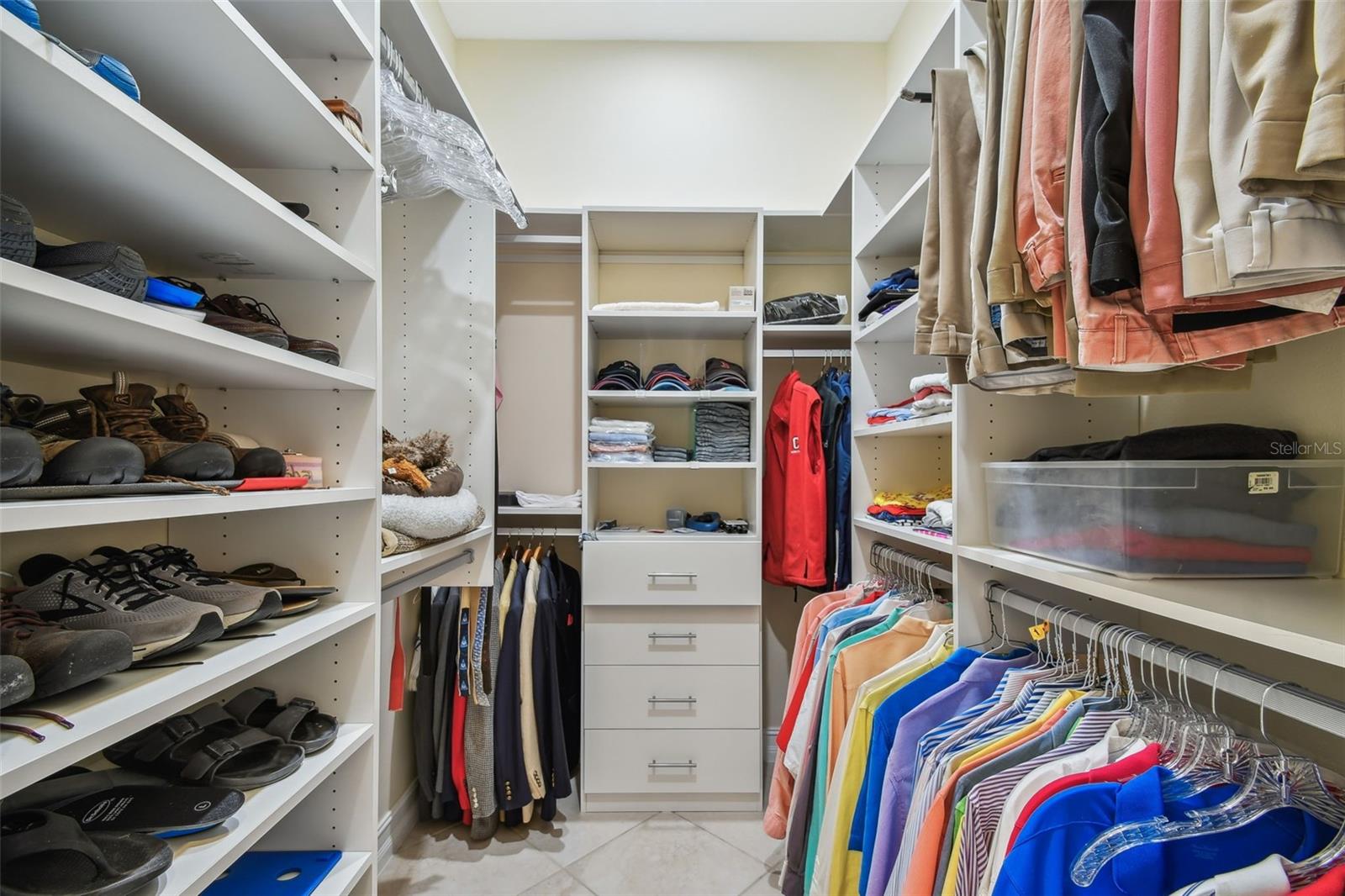 One of 2 walk-in closets in the primary suite.  Newly renovated with custom California closets
