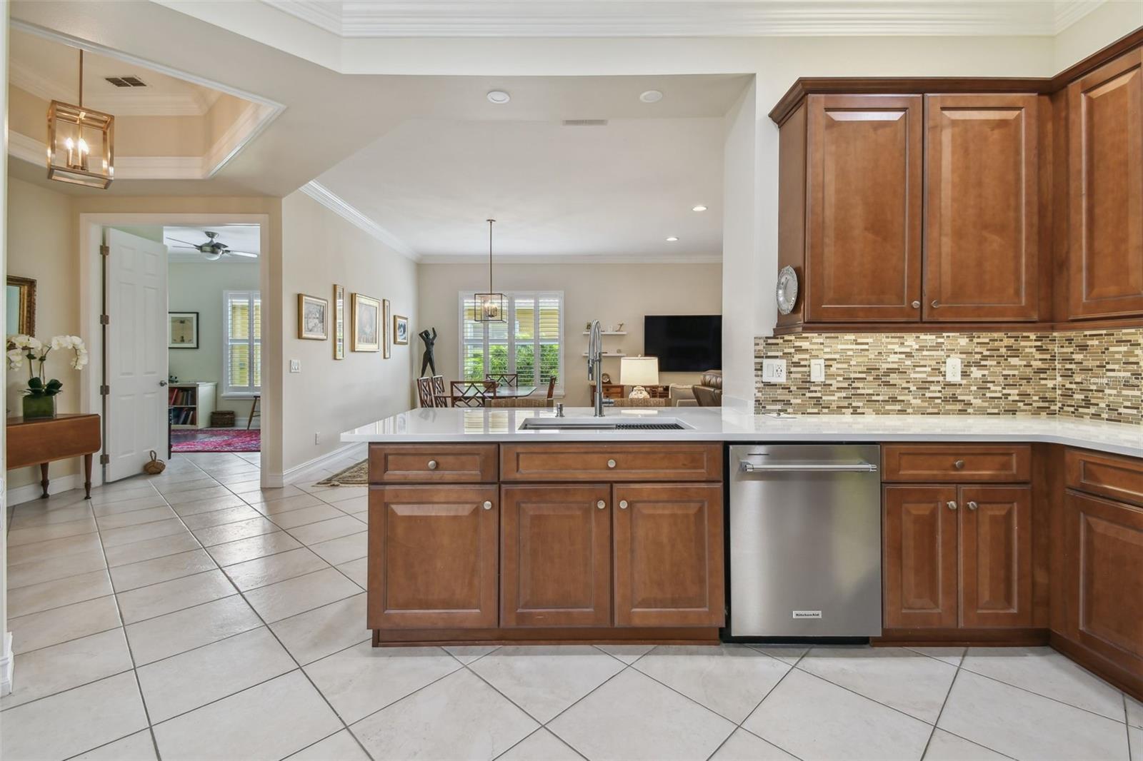 Counter height quartz top allows for the greatest utilization of counter space - perfect for entertaining.