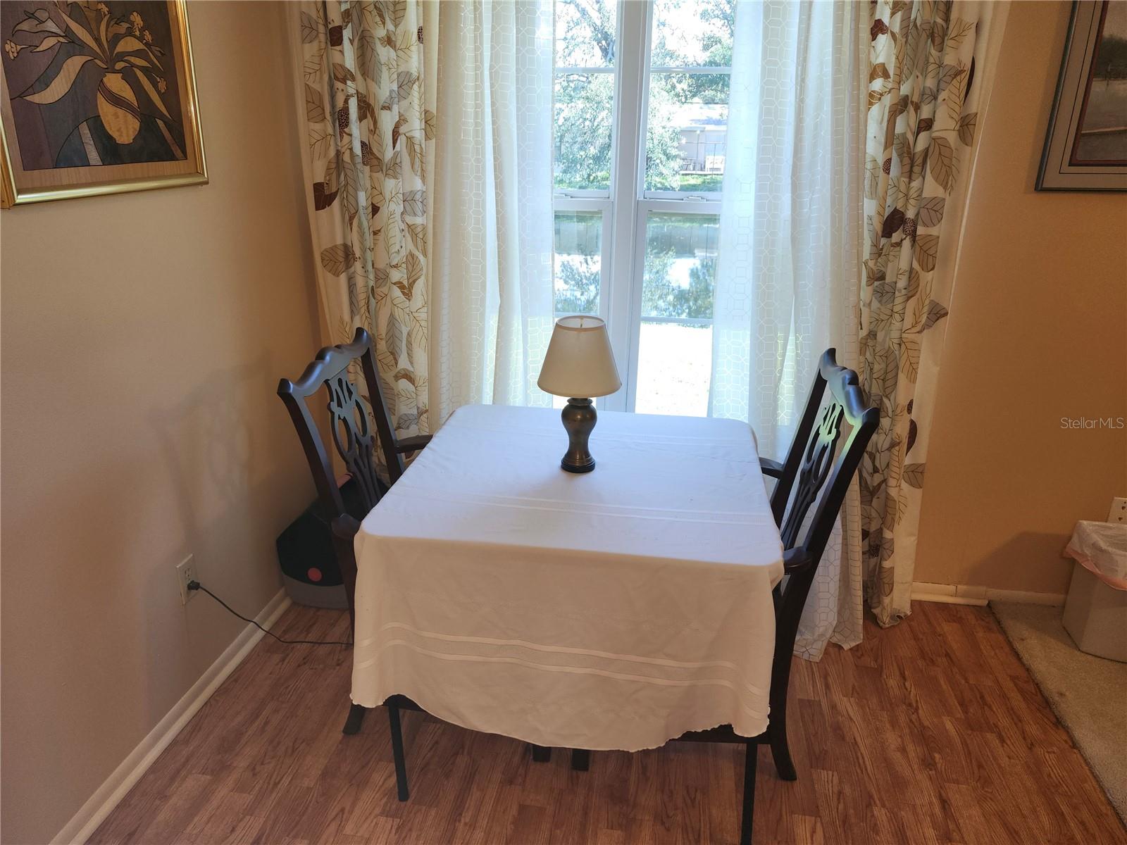 Breakfast Nook Off Kitchen With View of Pond