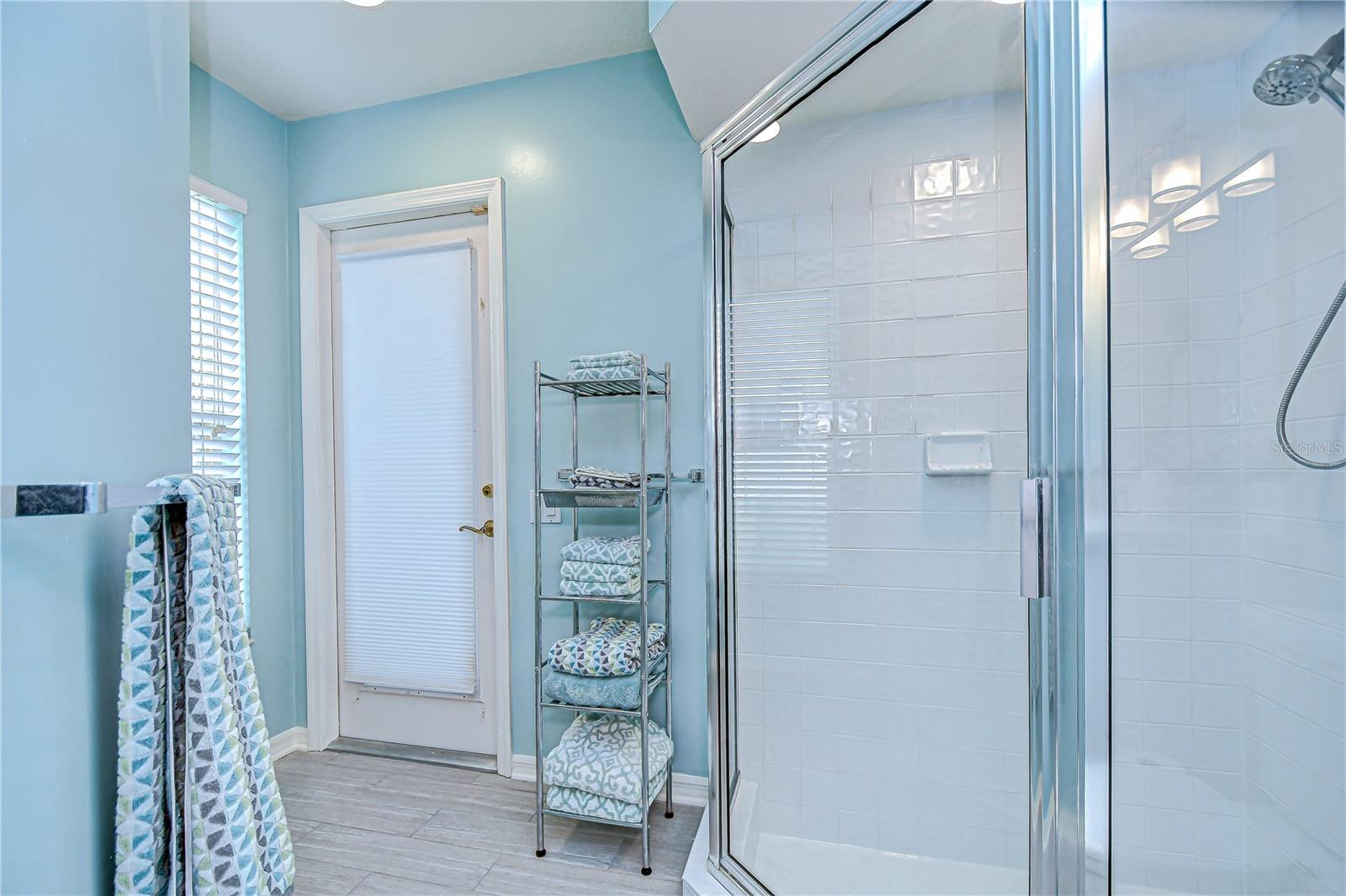 Ensuite (Bathroom#3)with shower, quartz countertop, & linen closet.
