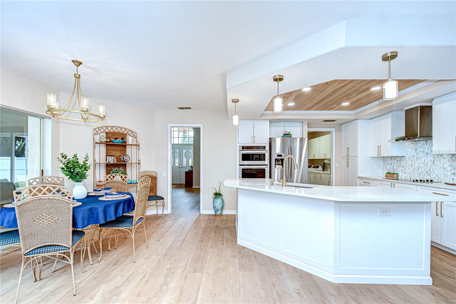 View toward the foyer from your kitchen and family room areas