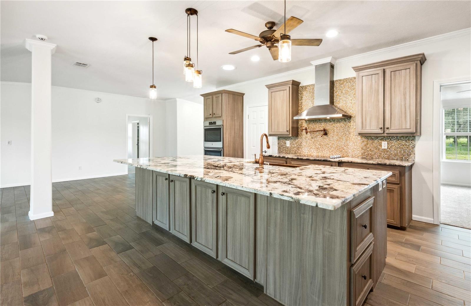 Oversized granite breakfast bar perfect for casual dining and entertaining.