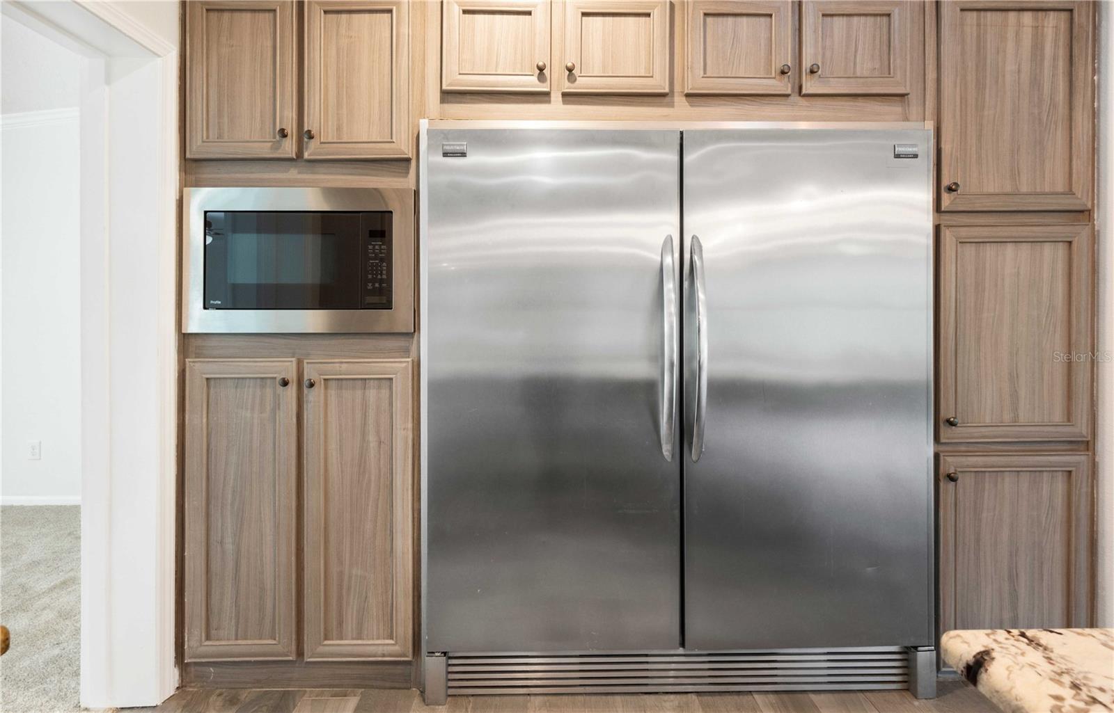 Equipped with a professional-grade, oversized side-by-side refrigerator/freezer—ideal for entertaining and extended storage