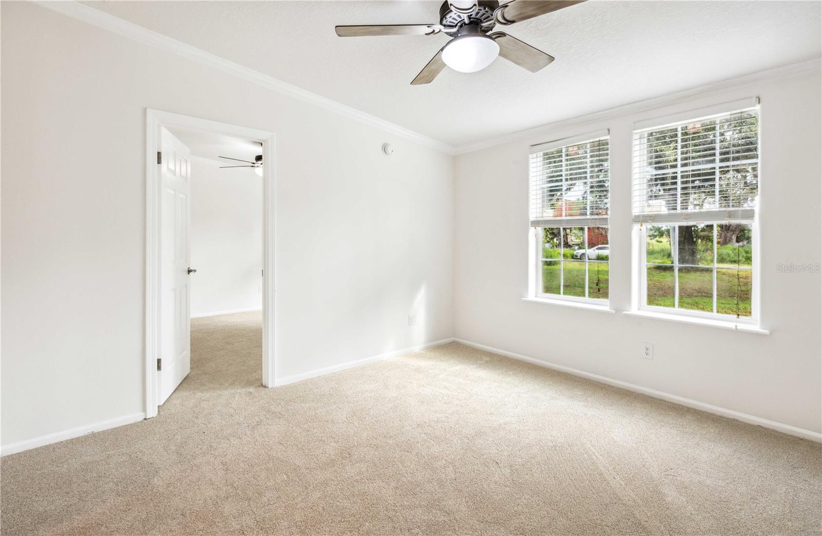 Versatile flex room perfect for a home office, playroom, or guest space.