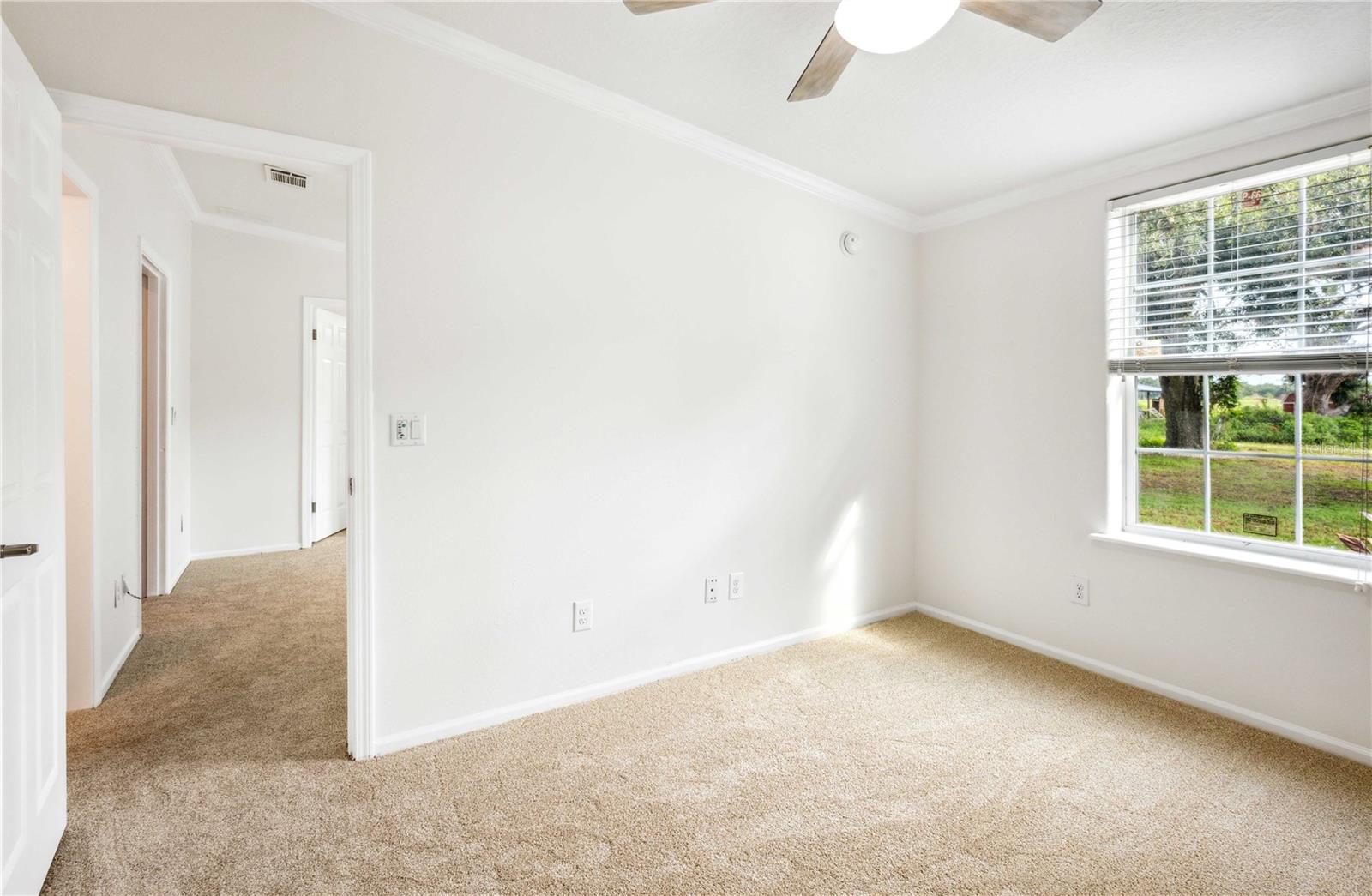 Bedroom three adjoins the flex room, offering flexible living space.