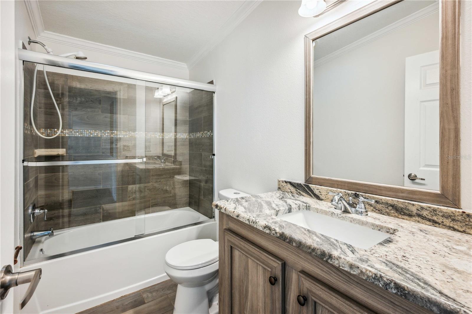 Bathroom three is conveniently located just outside bedroom four.