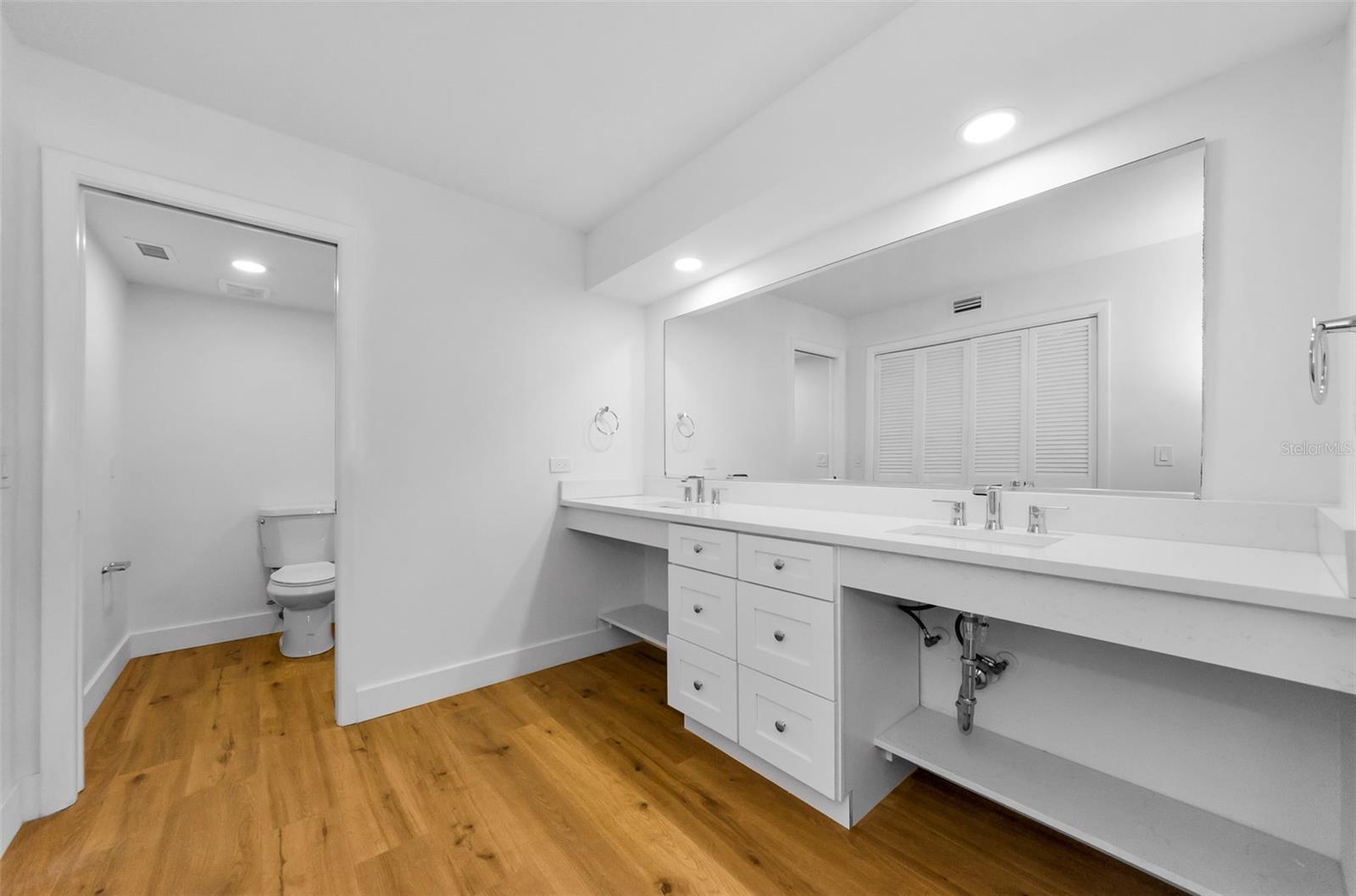 Primary Bath with new sinks, quartz countertops, & more!