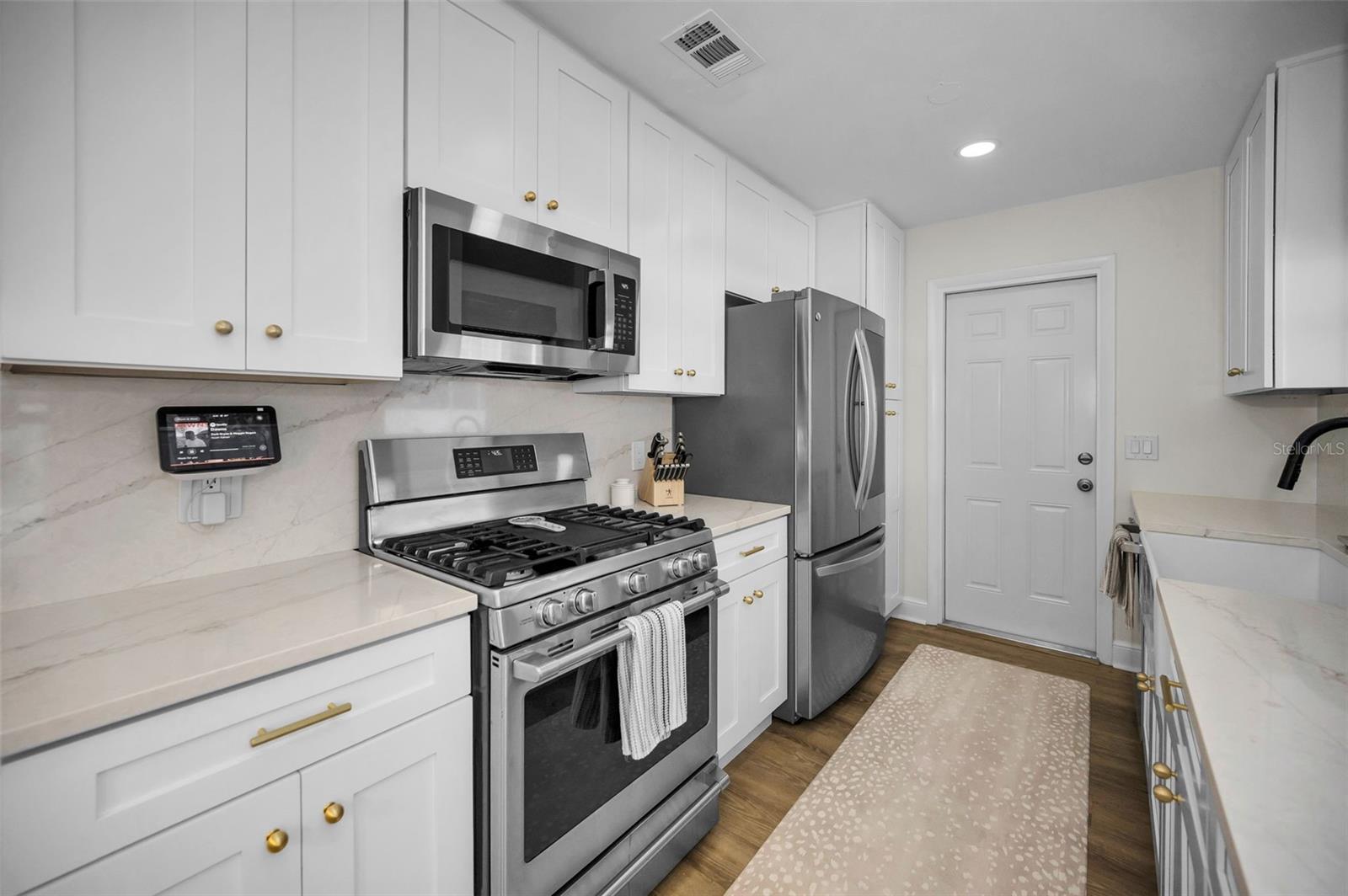 Remodeled Kitchen with Quarts Countertops and Plenty of Storage