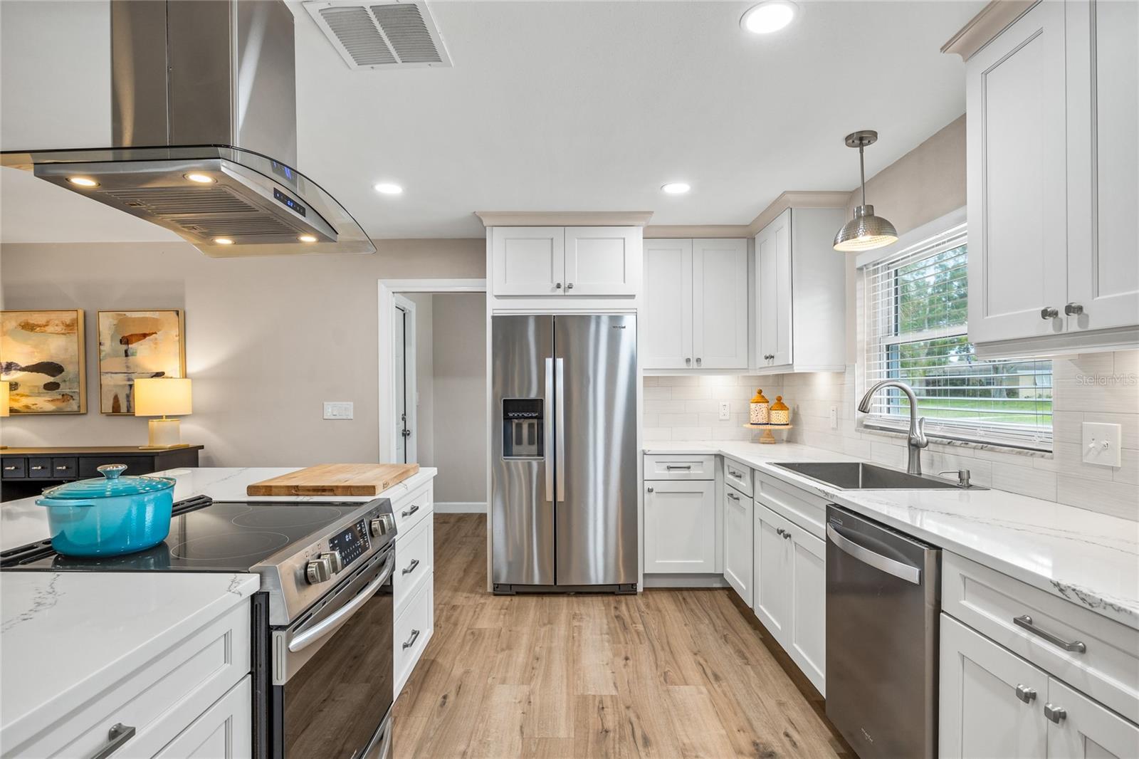 This kitchen is simply stunning with so much counter space for meal prepping and large windows with a beautiful view out to the front yard.