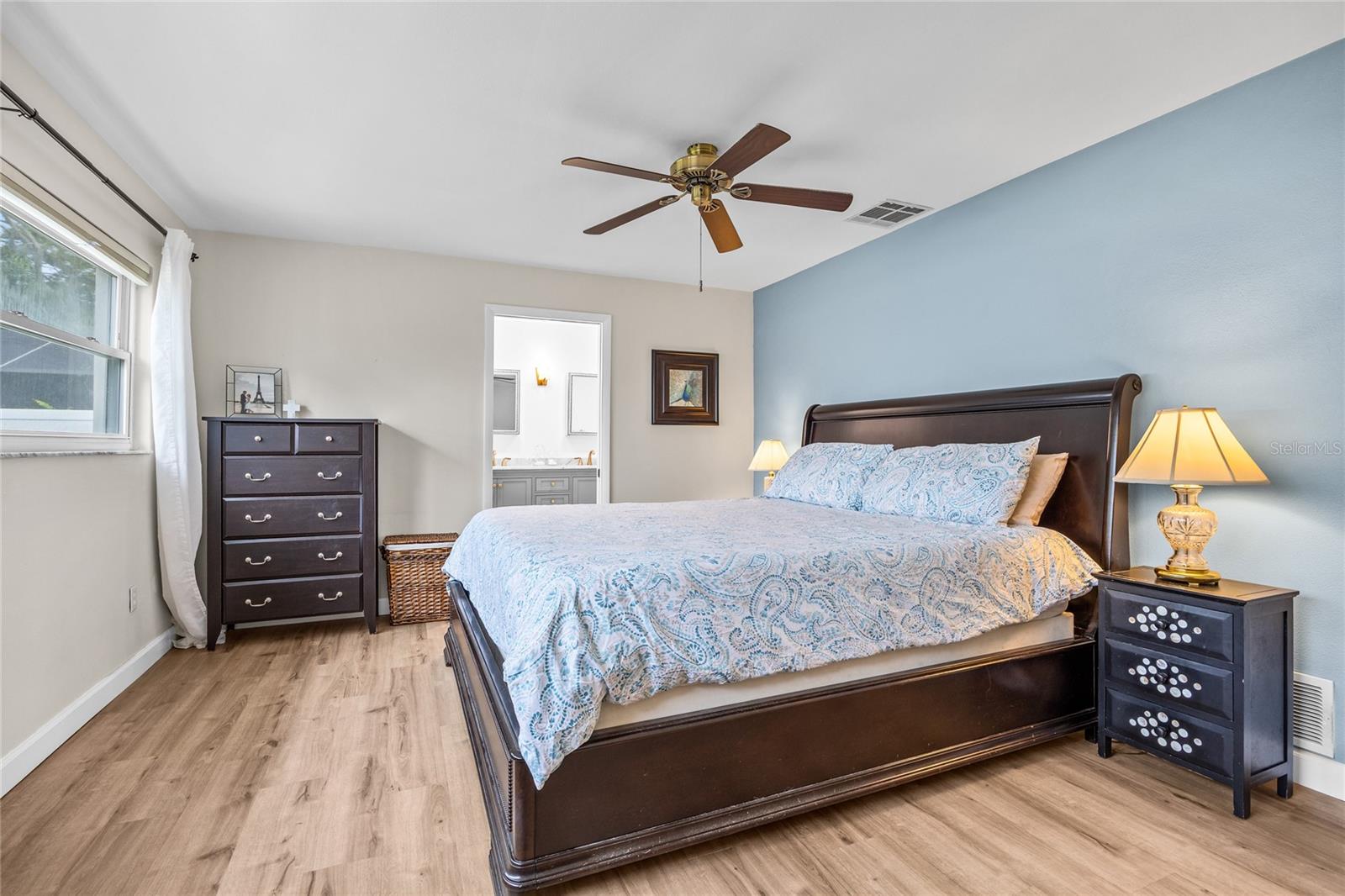 The Primary Bedroom is spacious and has large windows with a great view of the back yard, an ensuite bathroom and walk in closet.